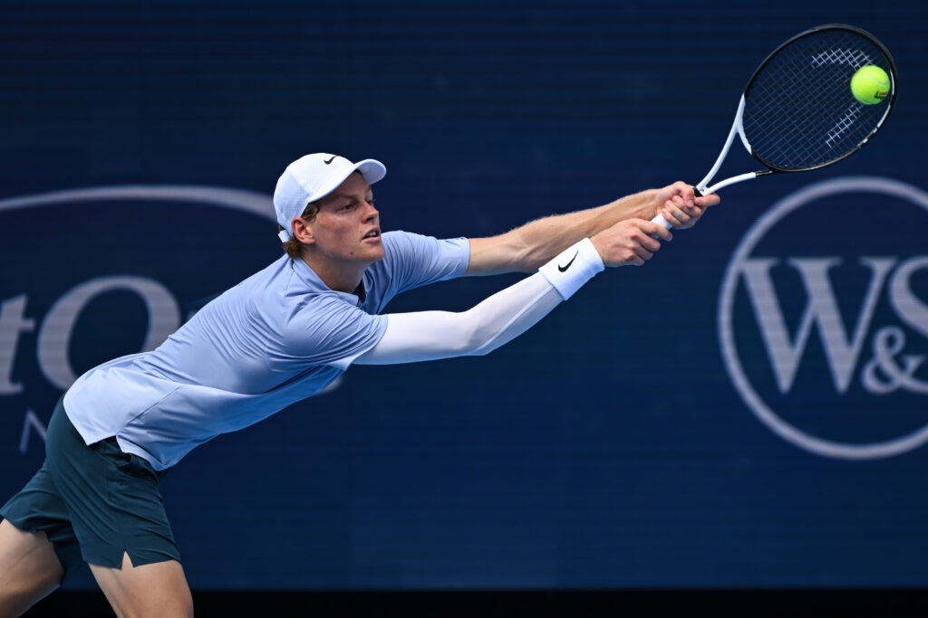Jannik Sinner lunges to hit a backhand at the Cincinnati Open 2025 - Day 8