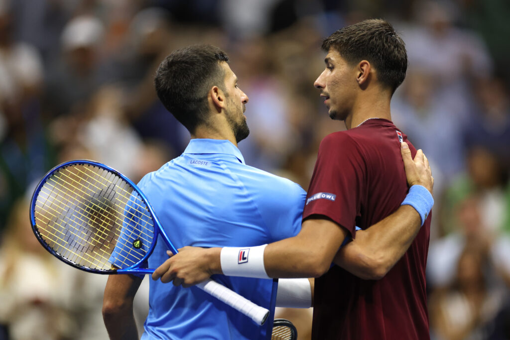 Alexei Popyrin of Australia shakes hands with Novak Djokovic of Serbia after winning their Men's Singles Third Round match on Day Five of the 2024 US Open at USTA Billie Jean King National Tennis Center on August 30, 2024 in the Flushing neighborhood of the Queens borough of New York City.